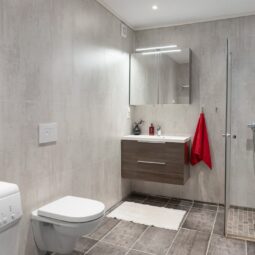 modern clean bathroom with new toilet - toilet replacement cost